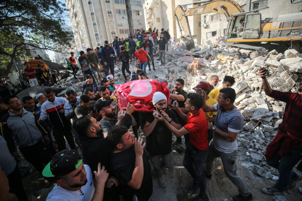 Palestine dead body of a child carried from bombed building by Israeli airforce al Rimal neighbourhood Gaza City 16 5 21 ph Mustafa Hassona AA